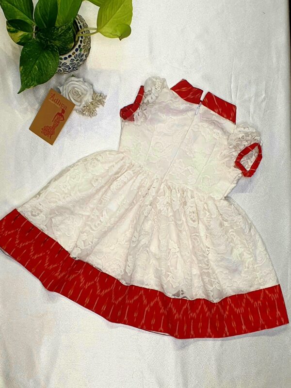 Baby frock *colour -white *Fabric- net and ikkat